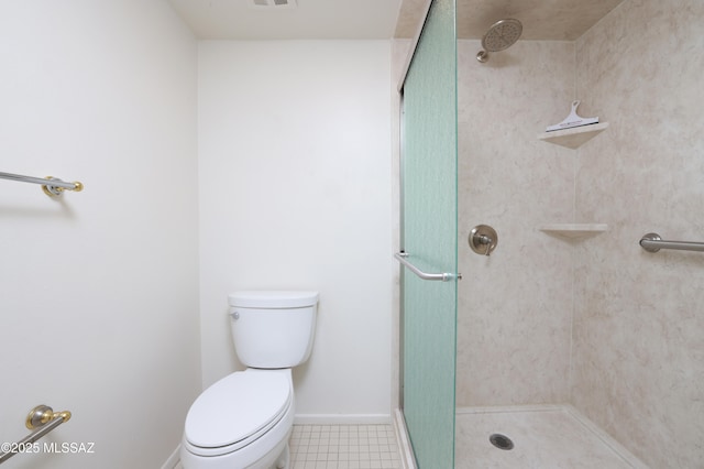 bathroom featuring visible vents, baseboards, a shower stall, and toilet