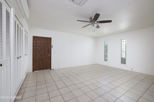 interior space featuring a closet, visible vents, and a ceiling fan