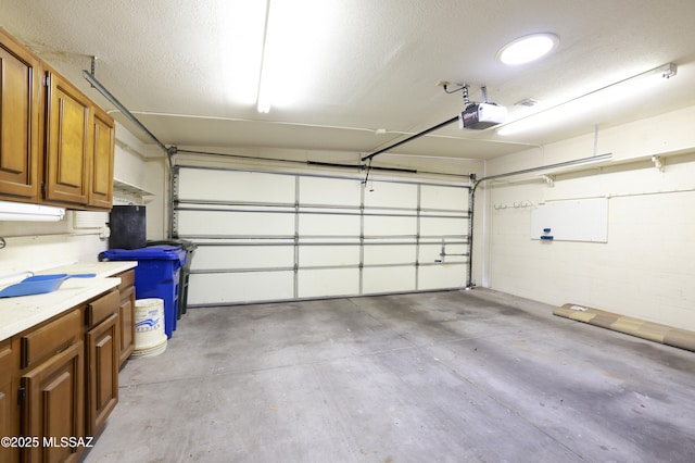 garage featuring a garage door opener