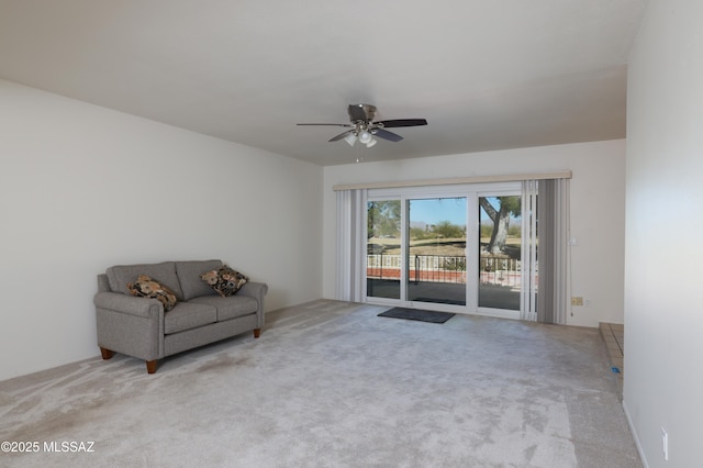 unfurnished room with carpet floors and a ceiling fan