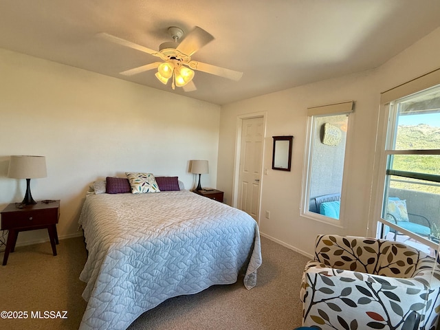 bedroom with carpet, baseboards, and ceiling fan