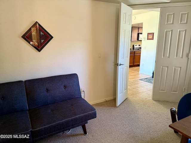 living area with light carpet