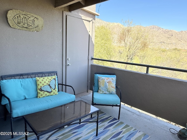 balcony featuring a mountain view