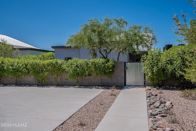 view of gate featuring fence