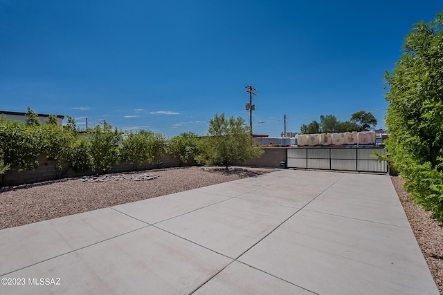 view of patio / terrace with a fenced backyard and a gate