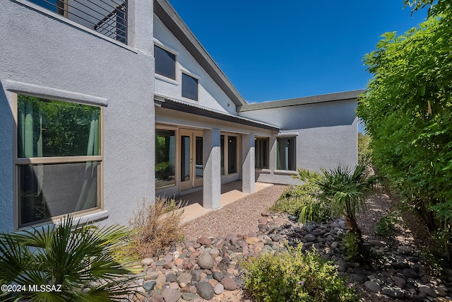 exterior space featuring stucco siding