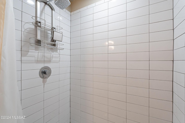 full bathroom with tiled shower