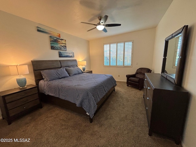 bedroom featuring dark carpet, baseboards, and ceiling fan