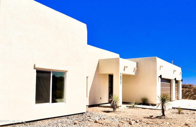 exterior space with stucco siding