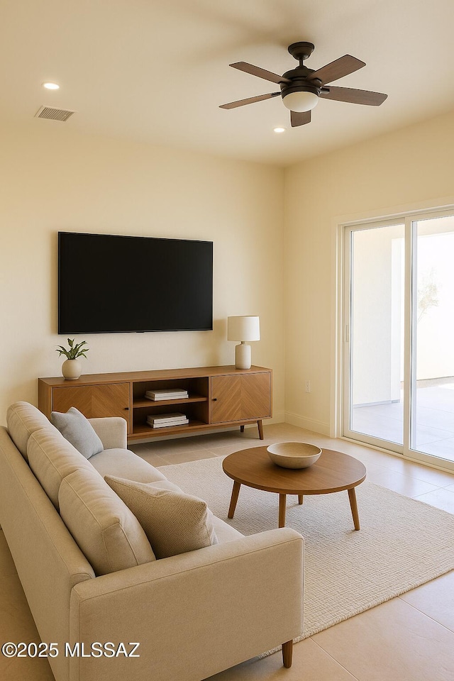 1077 Avenida Aire, Rio Rico, AZ 85648 - tiled living room with ceiling fan and recessed lighting