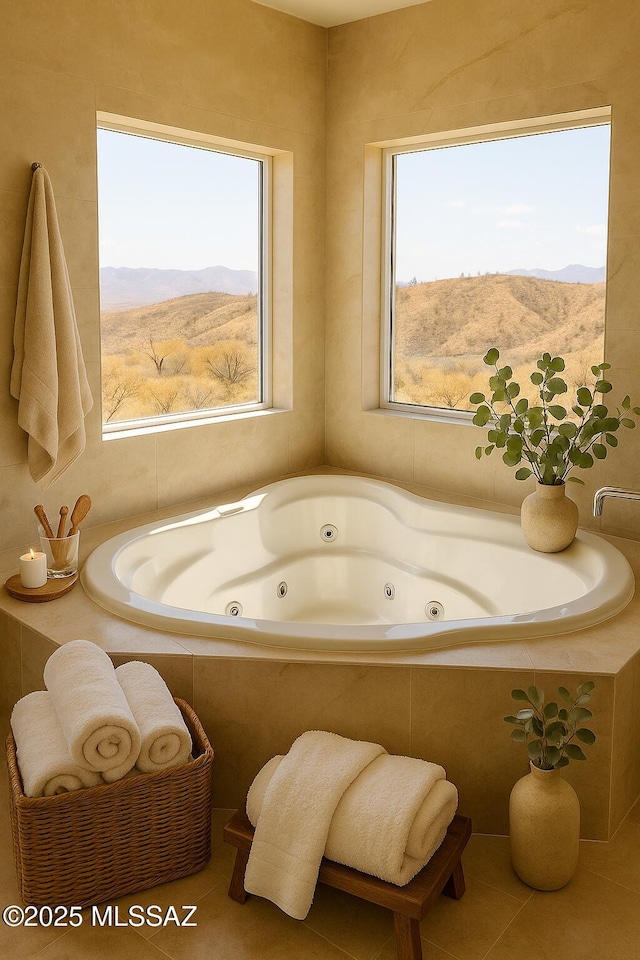 1077 Avenida Aire, Rio Rico, AZ 85648 - full bath with healthy amount of natural light, a mountain view, a jetted tub, and tile patterned flooring