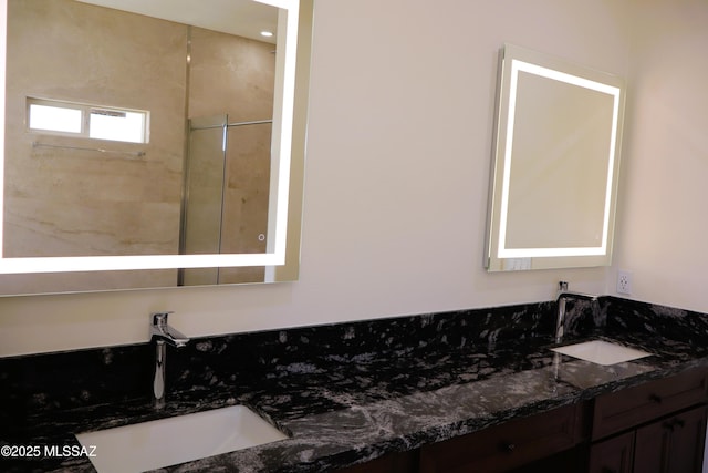 bathroom with double vanity and a sink