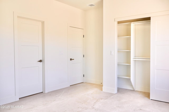 unfurnished bedroom featuring baseboards and visible vents