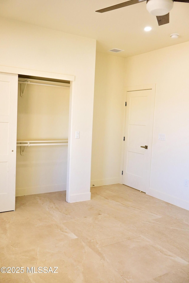 unfurnished bedroom featuring baseboards, a closet, ceiling fan, and visible vents
