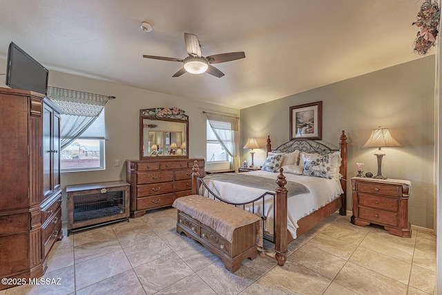 bedroom featuring a ceiling fan and light tile patterned floors