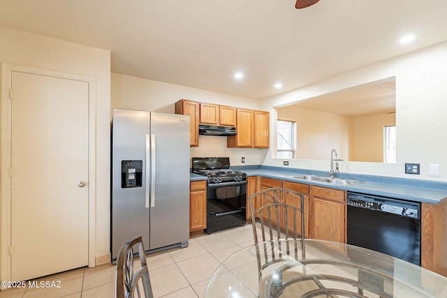 kitchen with light tile patterned floors, recessed lighting, a sink, under cabinet range hood, and black appliances