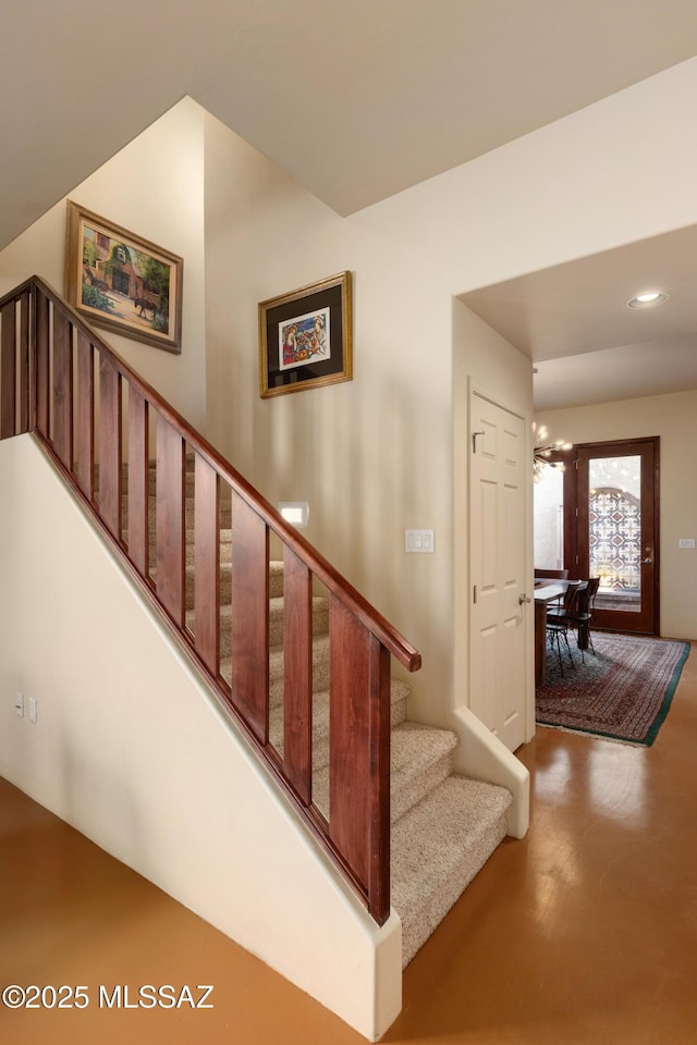 stairs featuring recessed lighting