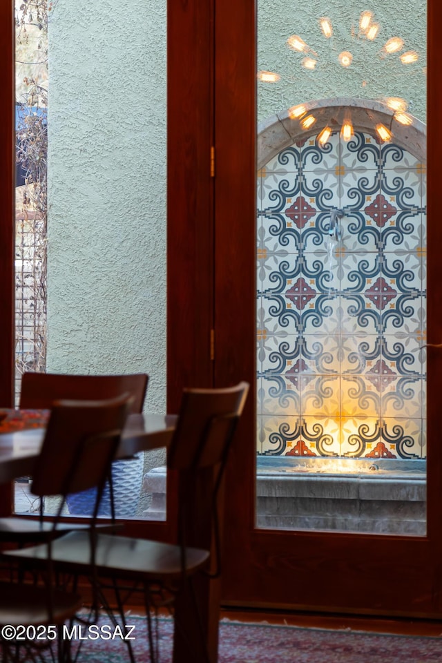 dining room featuring a textured wall