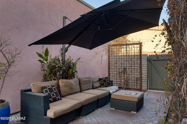 view of patio featuring a gate and an outdoor living space