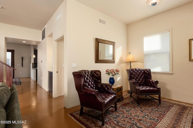 living area featuring visible vents