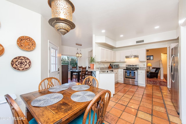 dining room with a toaster, visible vents, a notable chandelier, and recessed lighting