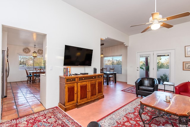 living room with a wealth of natural light and ceiling fan