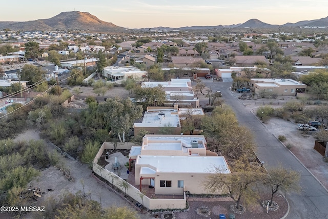 aerial view at dusk with a residential view and a mountain view