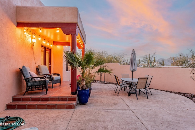 view of patio featuring outdoor dining area