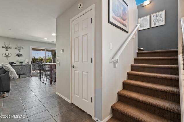 stairway featuring recessed lighting and baseboards