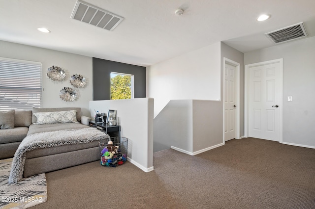 carpeted bedroom featuring baseboards, visible vents, and recessed lighting