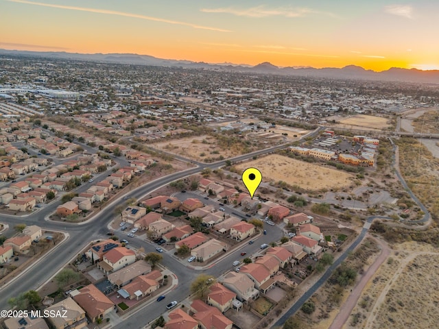 aerial view at dusk with a residential view and a mountain view