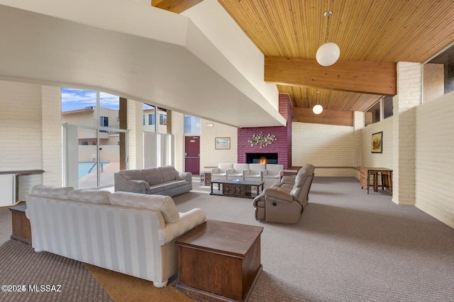 living area featuring carpet floors, beam ceiling, a fireplace, and brick wall