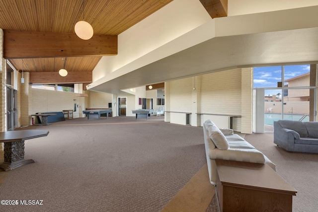 interior space with a towering ceiling, wooden ceiling, plenty of natural light, and beam ceiling