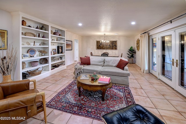 living area with light tile patterned floors, french doors, a chandelier, and recessed lighting