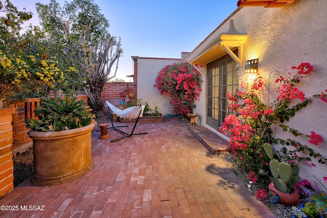 view of patio / terrace with french doors and fence