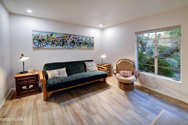 interior space featuring recessed lighting, baseboards, and wood finished floors