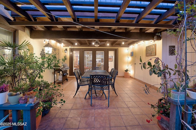 view of patio with french doors, a pergola, and outdoor dining space