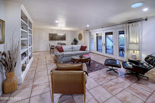 living area with french doors, light tile patterned flooring, recessed lighting, and a notable chandelier