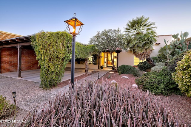 exterior space featuring stucco siding