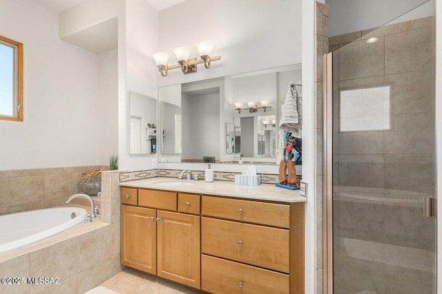 full bath with a garden tub, a shower stall, vanity, and tile patterned floors