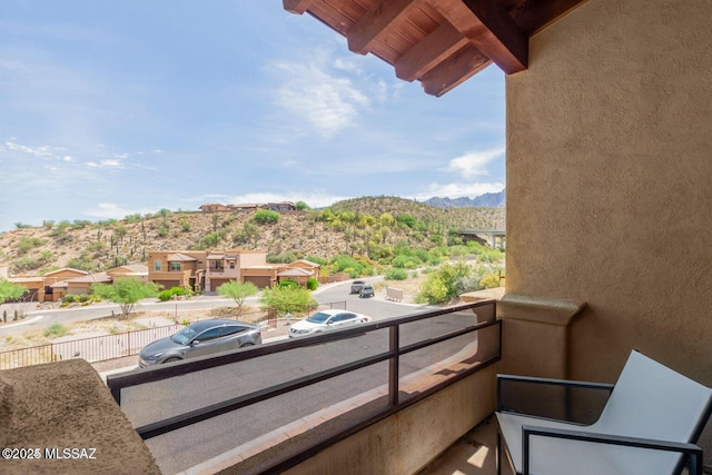 balcony featuring a mountain view