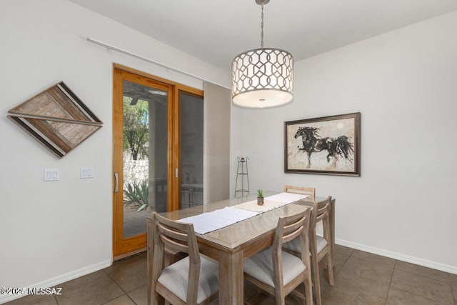 tiled dining area with baseboards