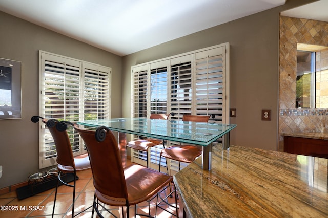 dining area with tile patterned flooring