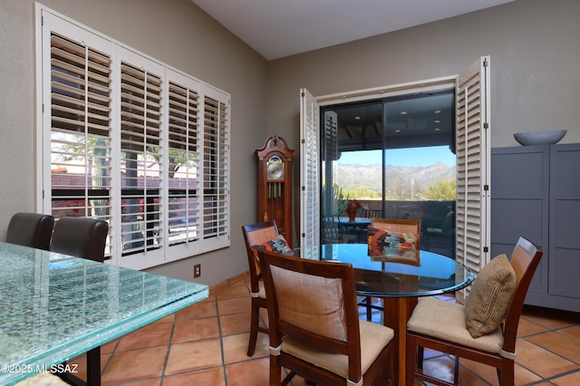 dining space featuring a healthy amount of sunlight and light tile patterned floors