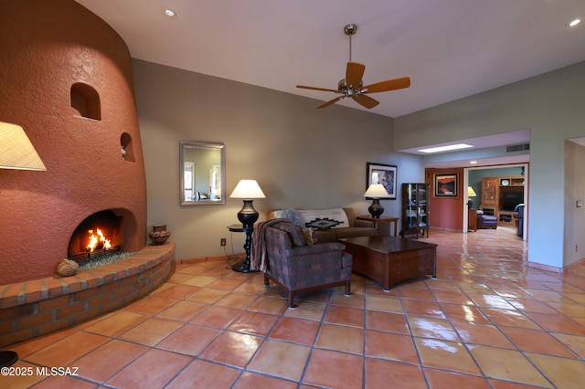 tiled living area with ceiling fan, recessed lighting, visible vents, baseboards, and a brick fireplace