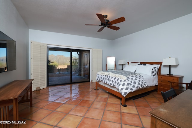 tiled bedroom with access to outside and ceiling fan