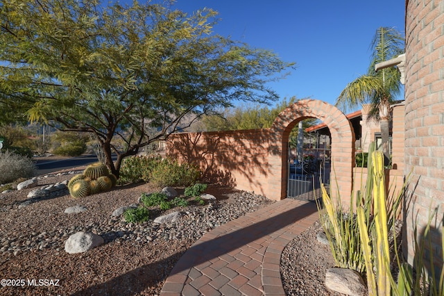 exterior space featuring fence and a gate