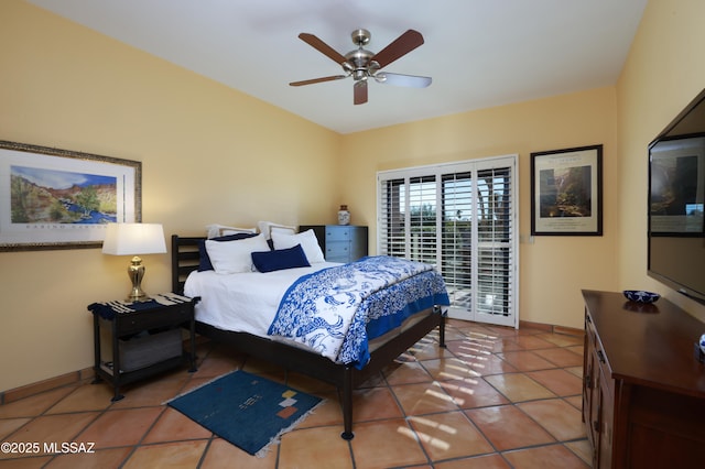 bedroom featuring access to exterior, ceiling fan, light tile patterned floors, and baseboards