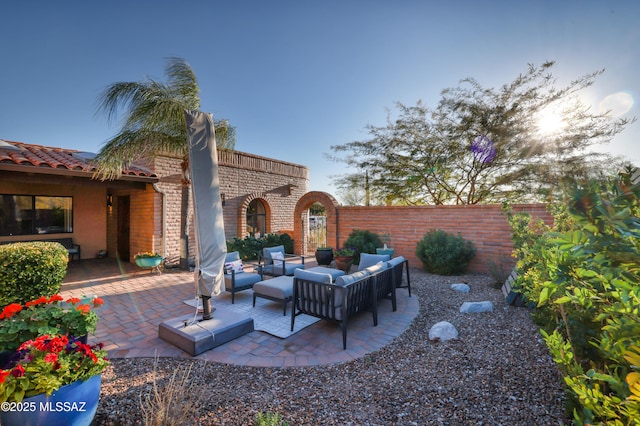 view of patio featuring fence and an outdoor living space