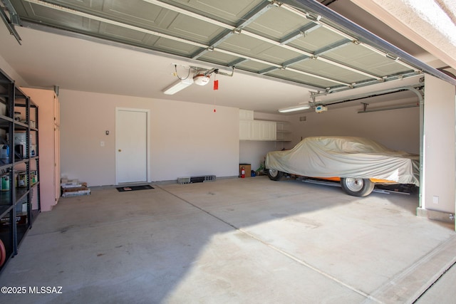 garage featuring a garage door opener